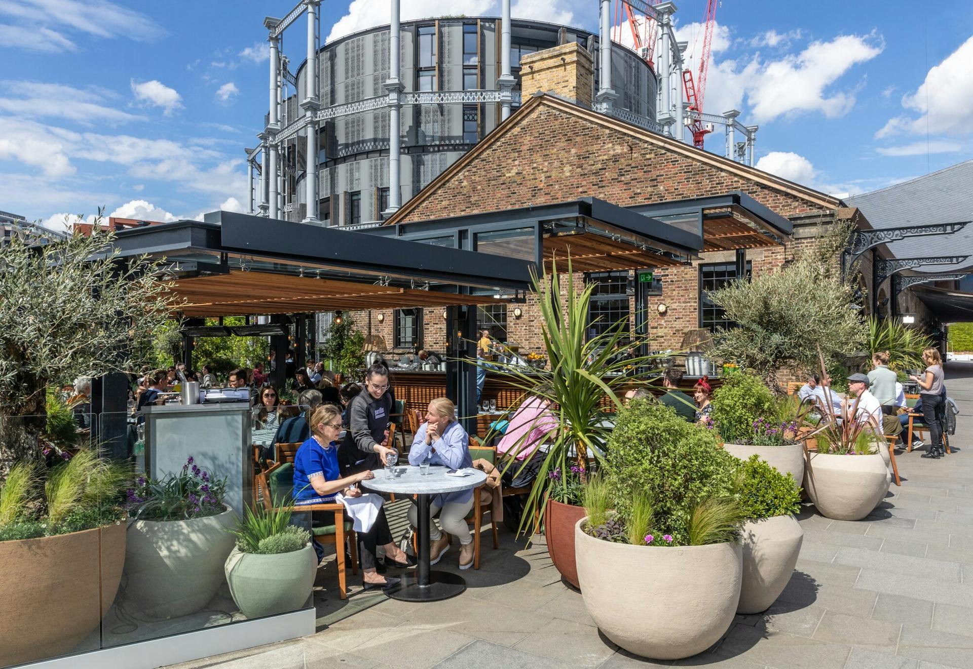 Diners at Parrillan, Coal Drops Yard, a restaurant bookable via the King's Cross and SevenRooms partnership. Image credit - John Sturrock